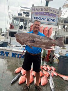 Captain Jason Mikel with Grouper Catch