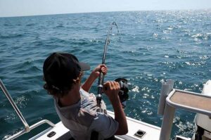 Catching a saltwater fish from a boat